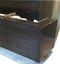 lobby desk metal cladding faux finish black oxide Toronto area hotel image