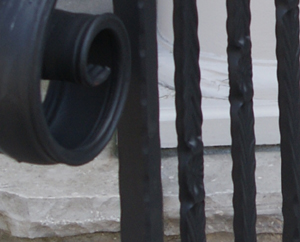 close-up of scrolled finishing of wrought iron handrail. GTA custom railing projces