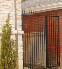 custom wrought iron fence panels installed between Toronto Area homes by Myriad Metal Designs also gate and handrail matching
