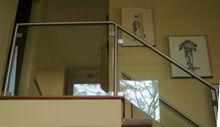 stainless steel and glass residential interior hand railing image